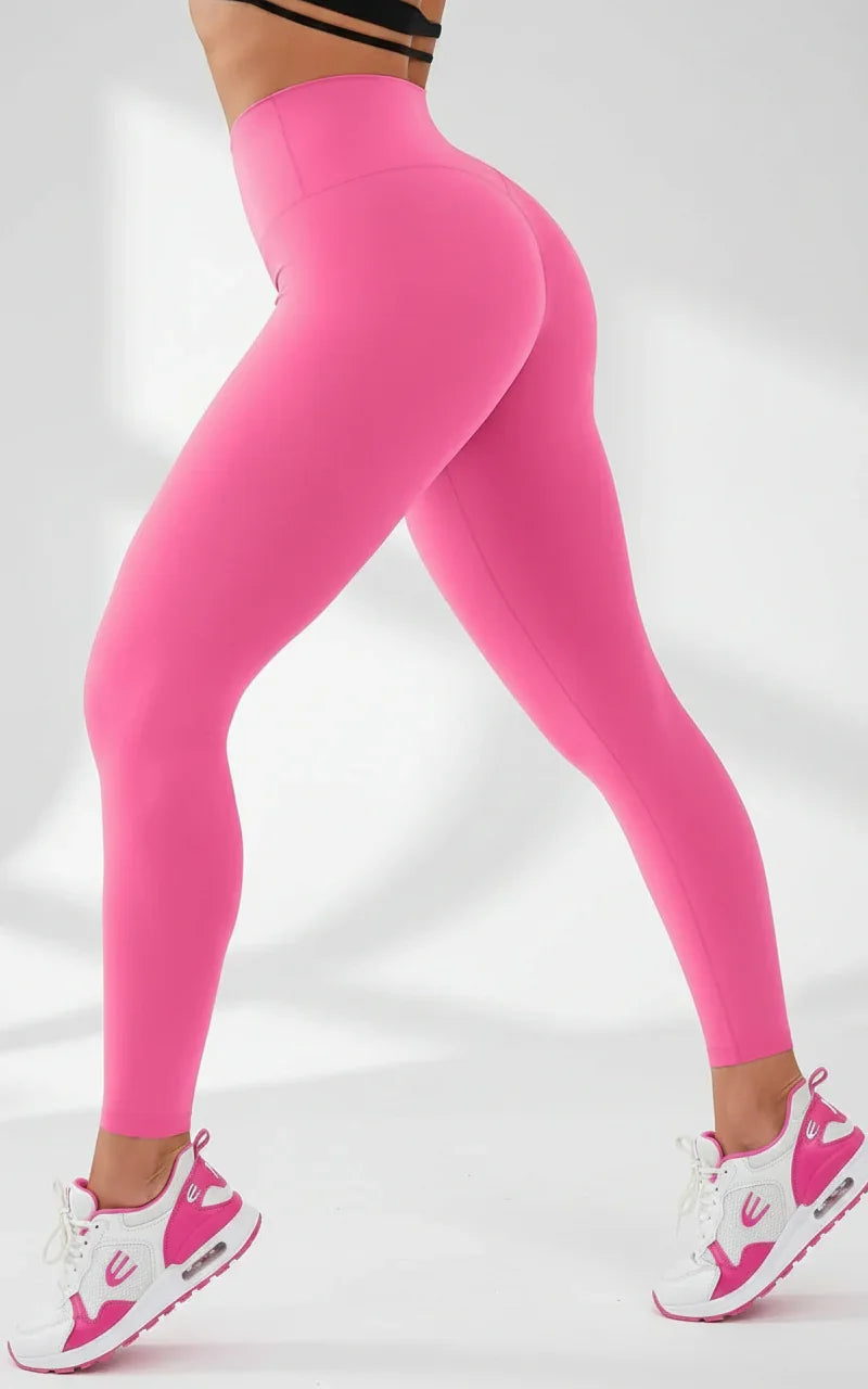 Side view of a Pink leggings worn by a person on a white background