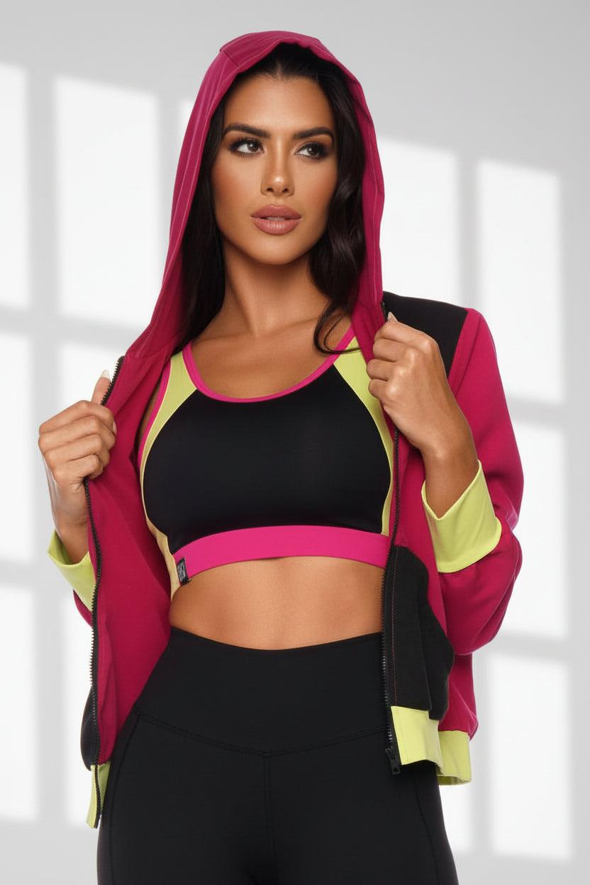 woman wearing a jacket and bra top in color block design.