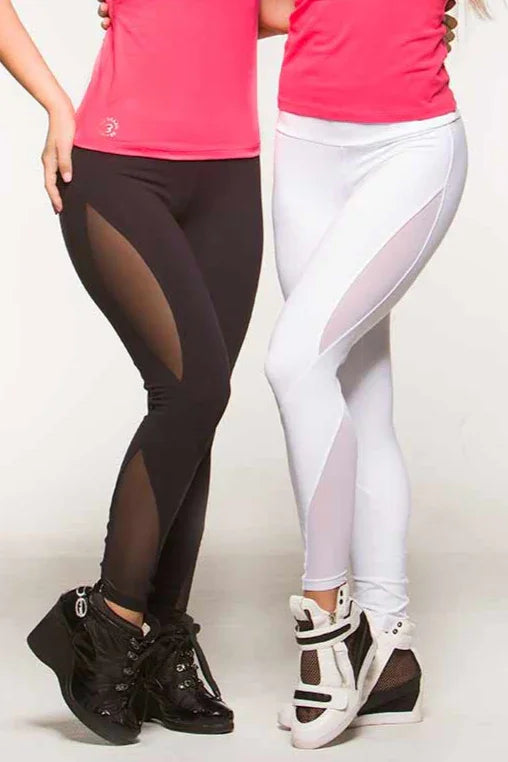 Two pairs of leggings, one in black and one in white, with cutout mesh side panels. The wearers are standing, one in front of the other, facing to the side with pink tops and active shoes.