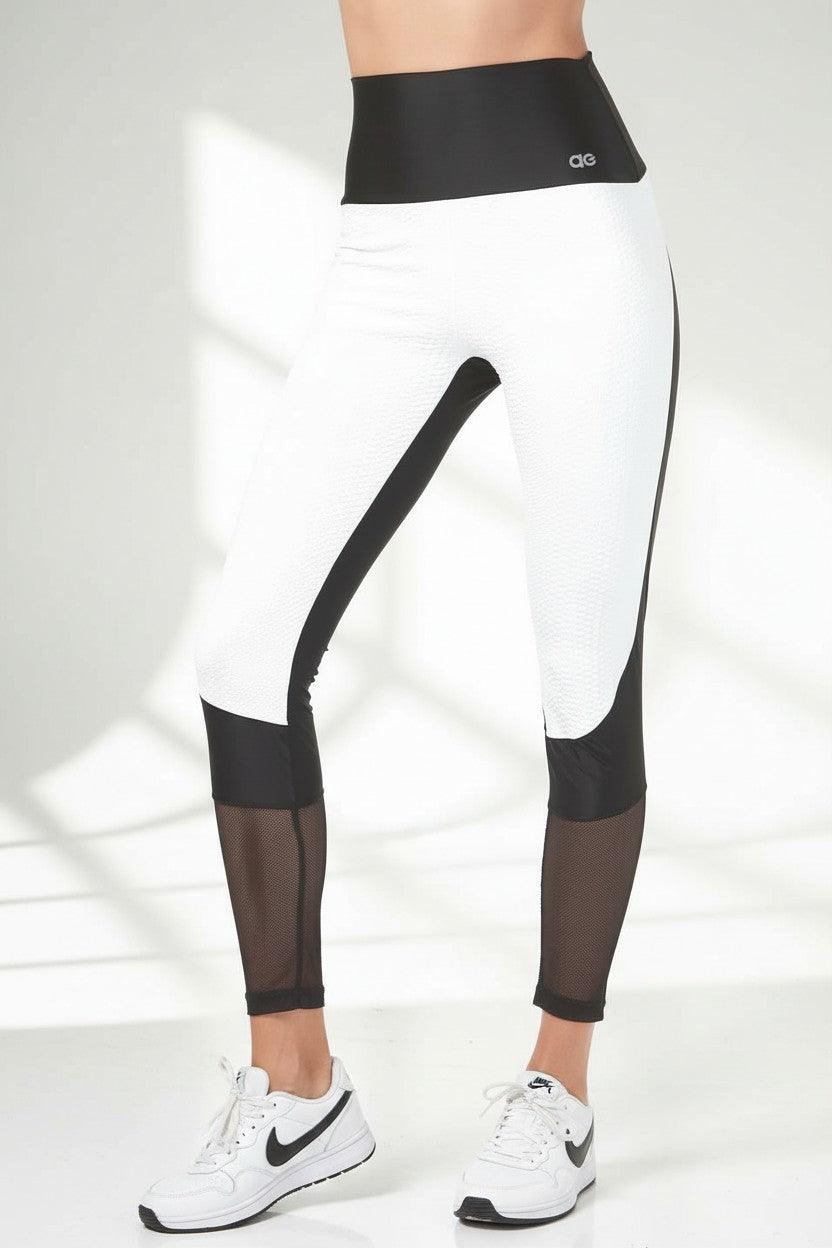 white python embossed supplex with black solid and mesh trim legging.