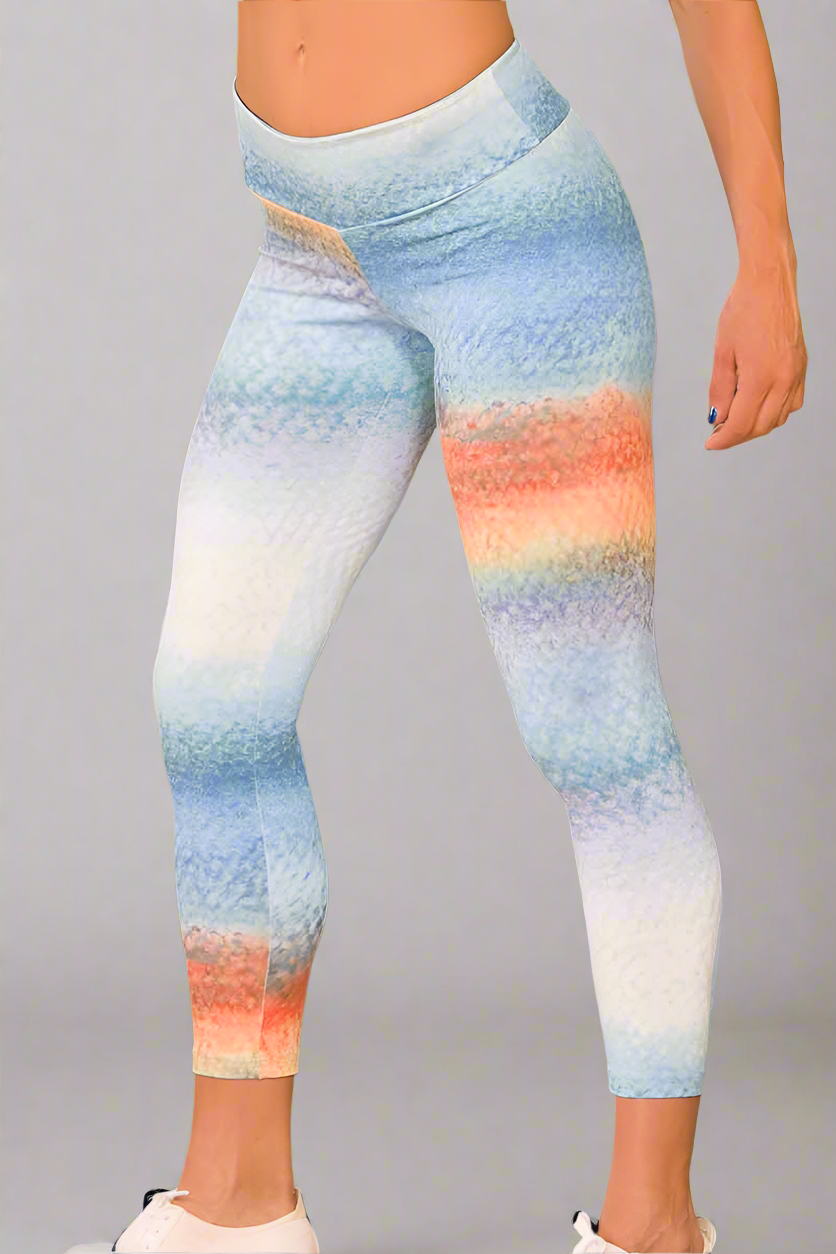 A pair of 3/4 length leggings with a digital print in shades of blue and white, and a removable hip cover.