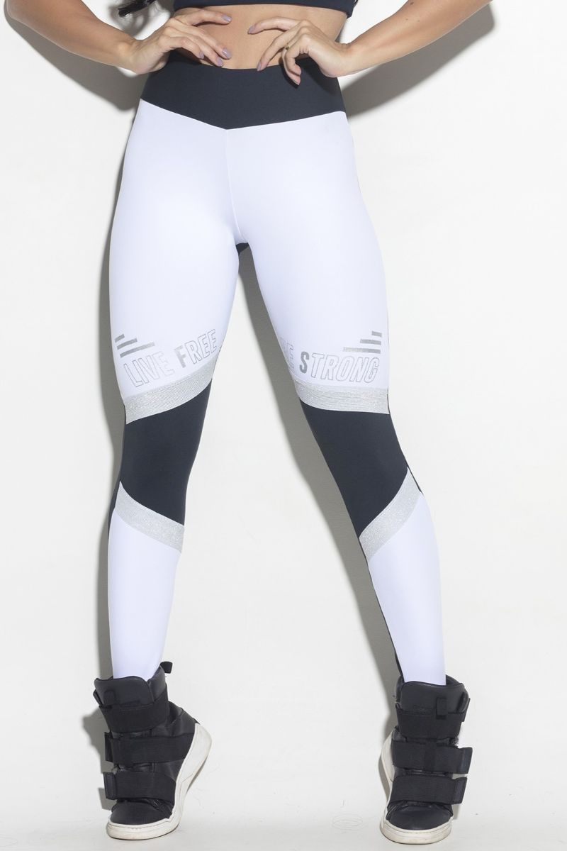 White and black leggings worn by a person on a white background